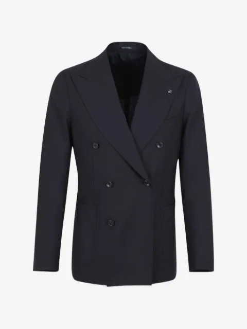 Tagliatore traje con doble botonadura