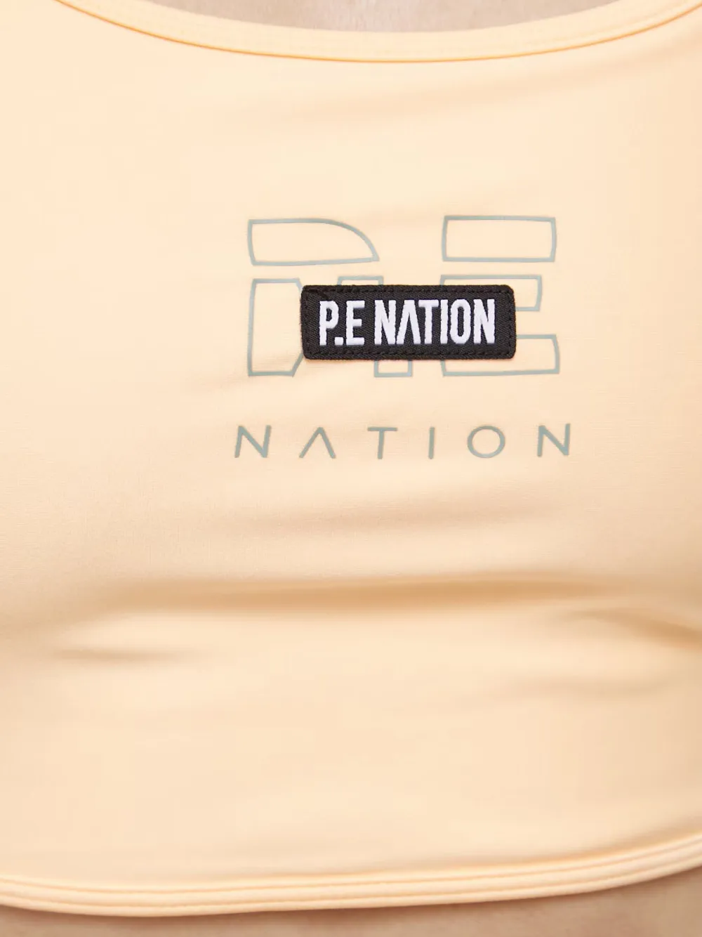 P.E Nation Sport-bh met logopatch Oranje