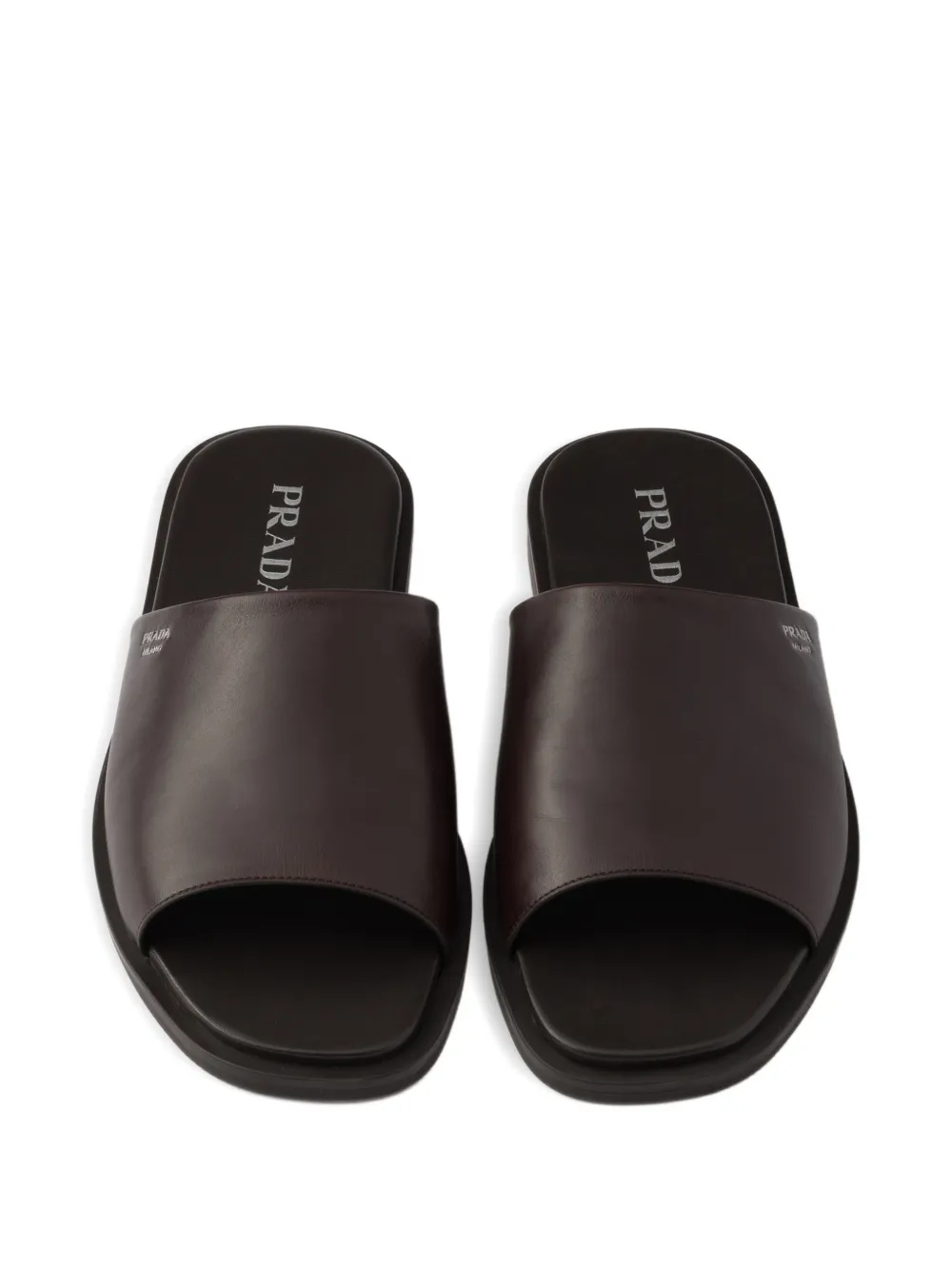 Prada Leren slippers Bruin