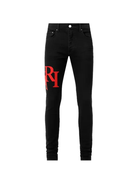 AMIRI staggered logo skinny jeans
