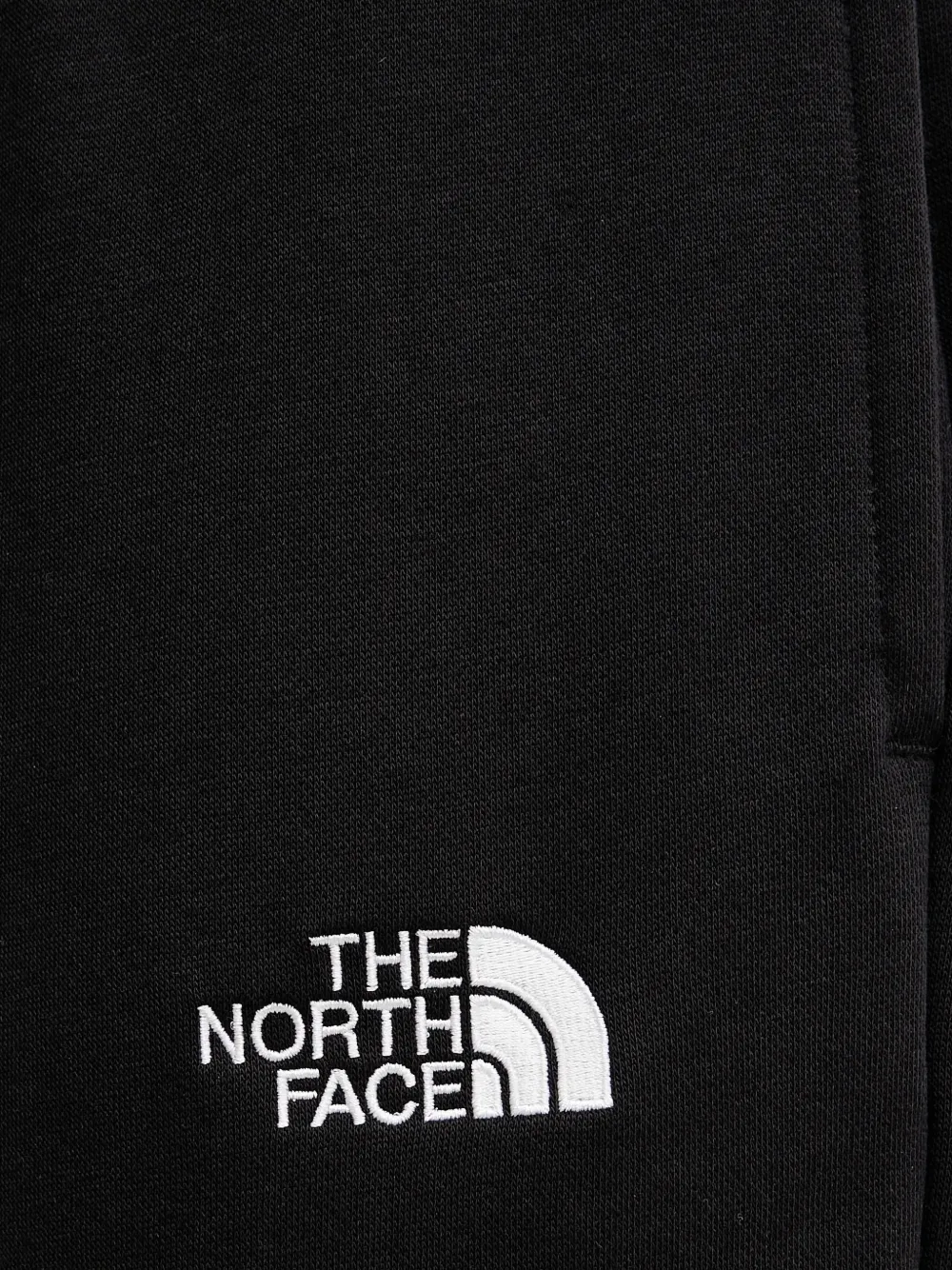 The North Face Essential ruimvallende trainingsbroek met trekkoord Zwart