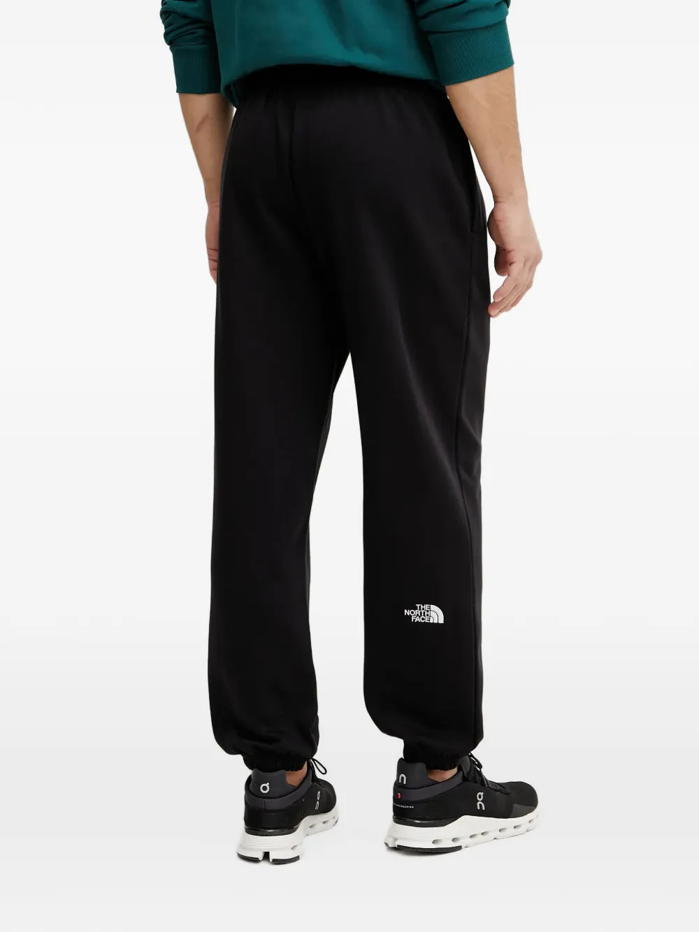 The North Face Essential ruimvallende trainingsbroek met trekkoord Zwart