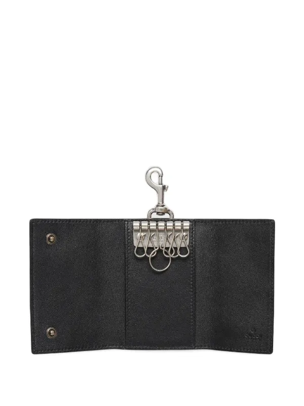 Gucci embossed-pattern Keychain | Black | FARFETCH