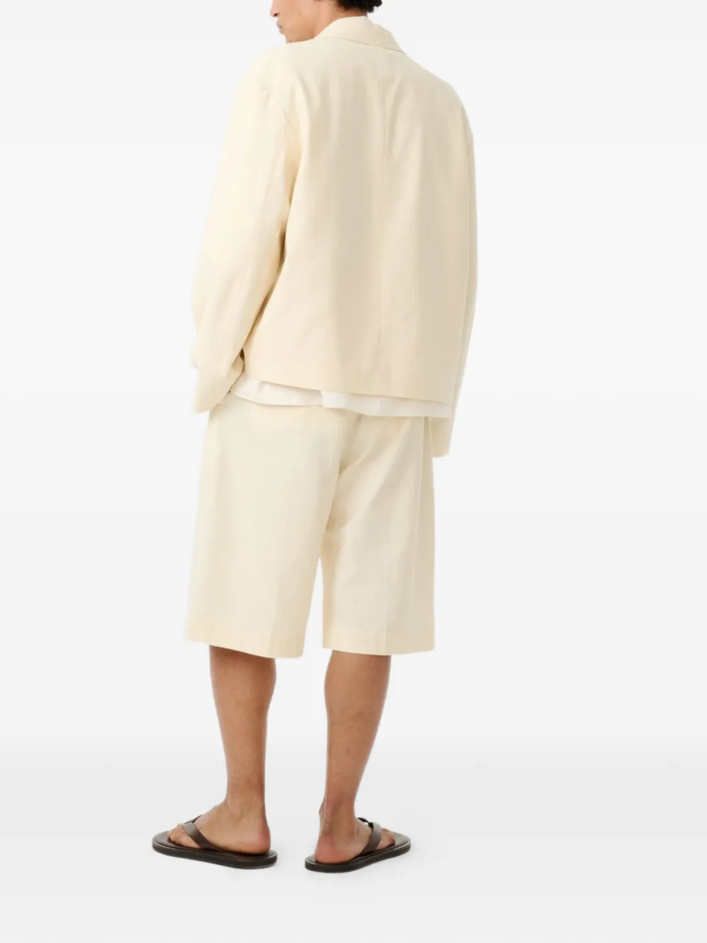 Studio Nicholson Fowld geplooide shorts met visgraatpatroon Beige