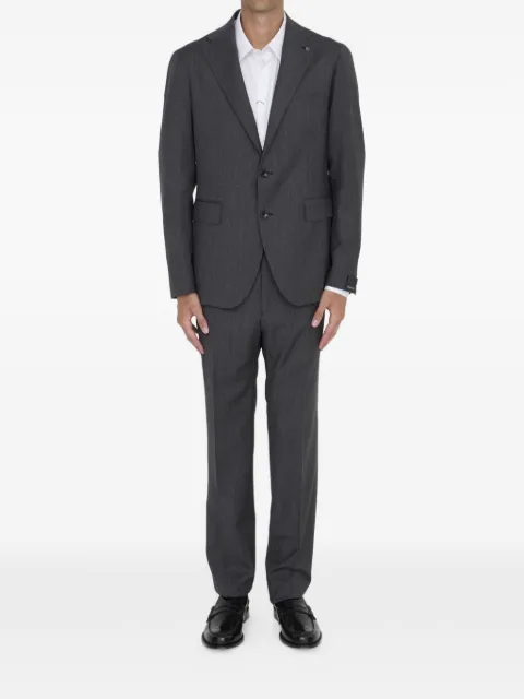Tagliatore traje con botones