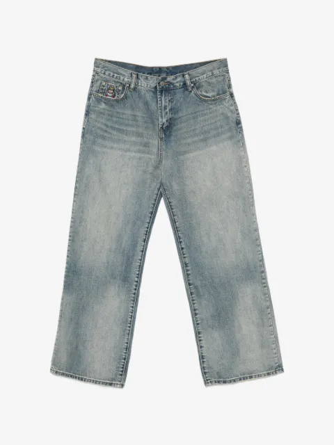 KidSuper jeans con parche de pájaro