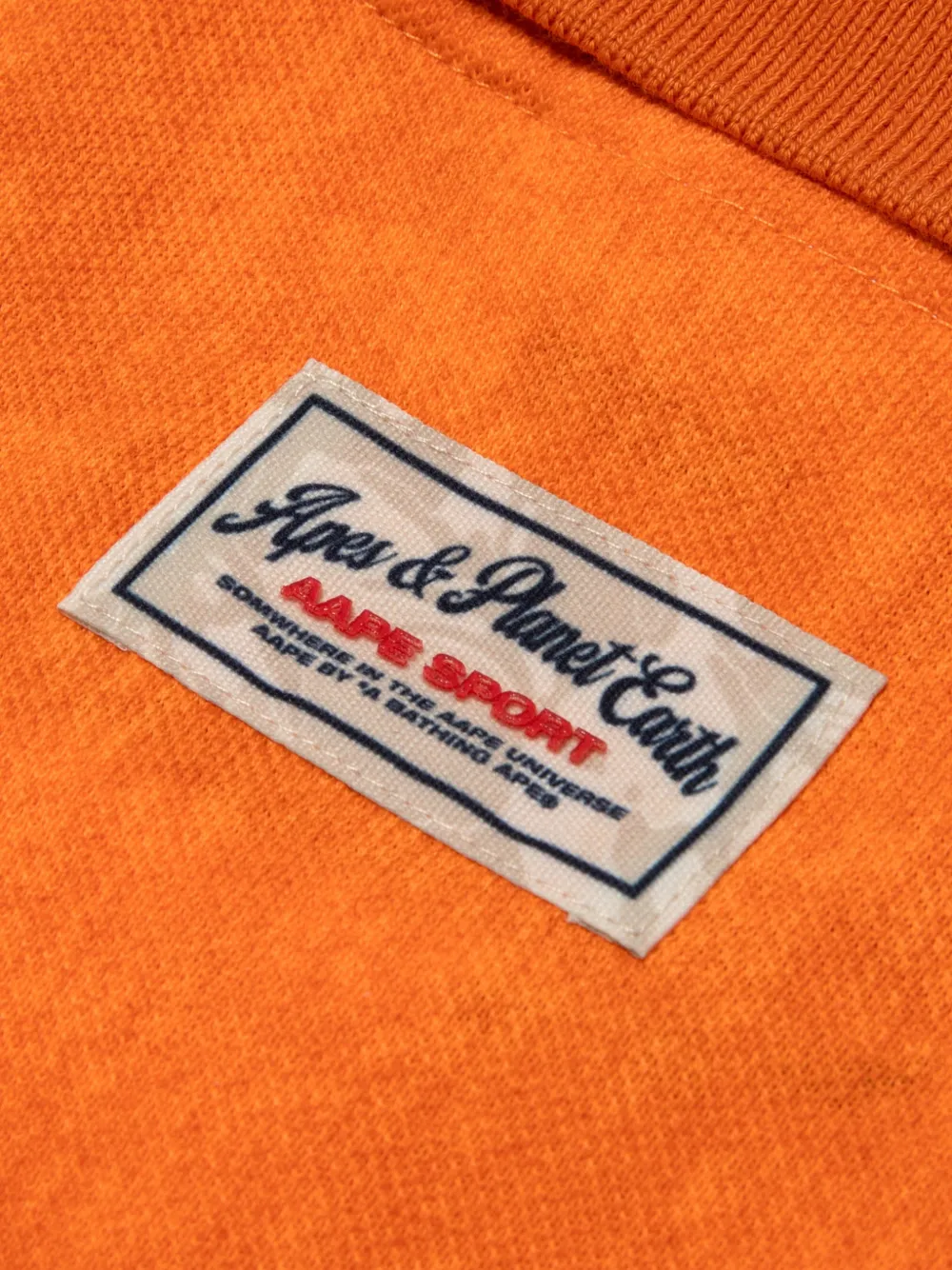 AAPE BY *A BATHING APE Poloshirt met logopatch en knopen Oranje