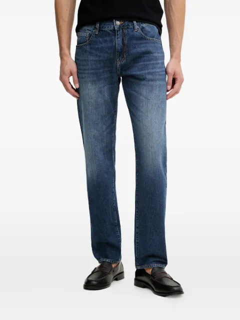 Armani Exchange logo-embroidered faded jeans