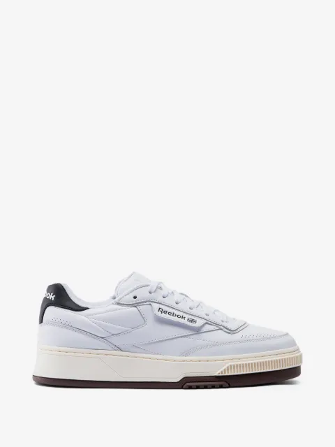 Reebok tenis con paneles perforados