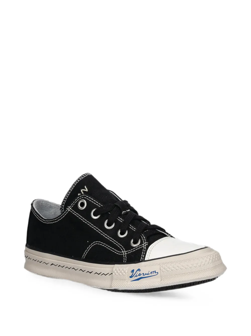 visvim Sneakers met contrasterende stiksels en logoprint Zwart