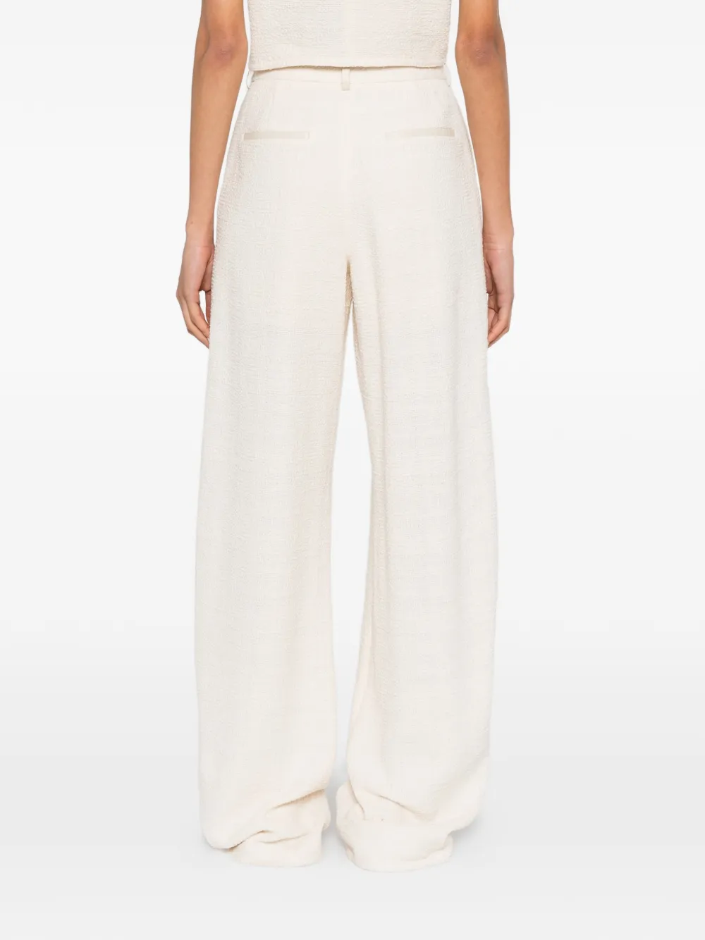 Nanushka Seka pantalon met toelopende pijpen Beige