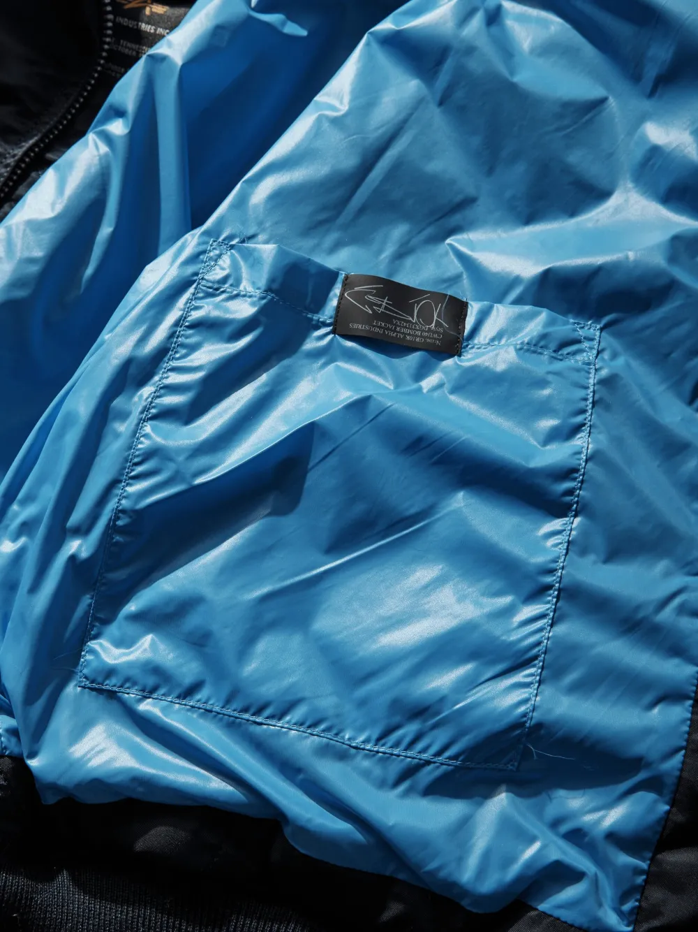 GR10K x Alpha Industries CWU-45 bomberjack met logopatch Blauw
