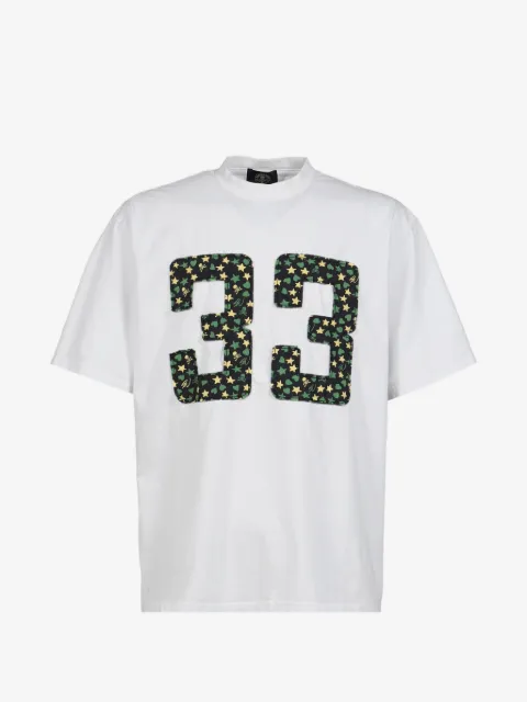 Mastermind Japan playera con parche en colaboración con Sean Wotherspoon