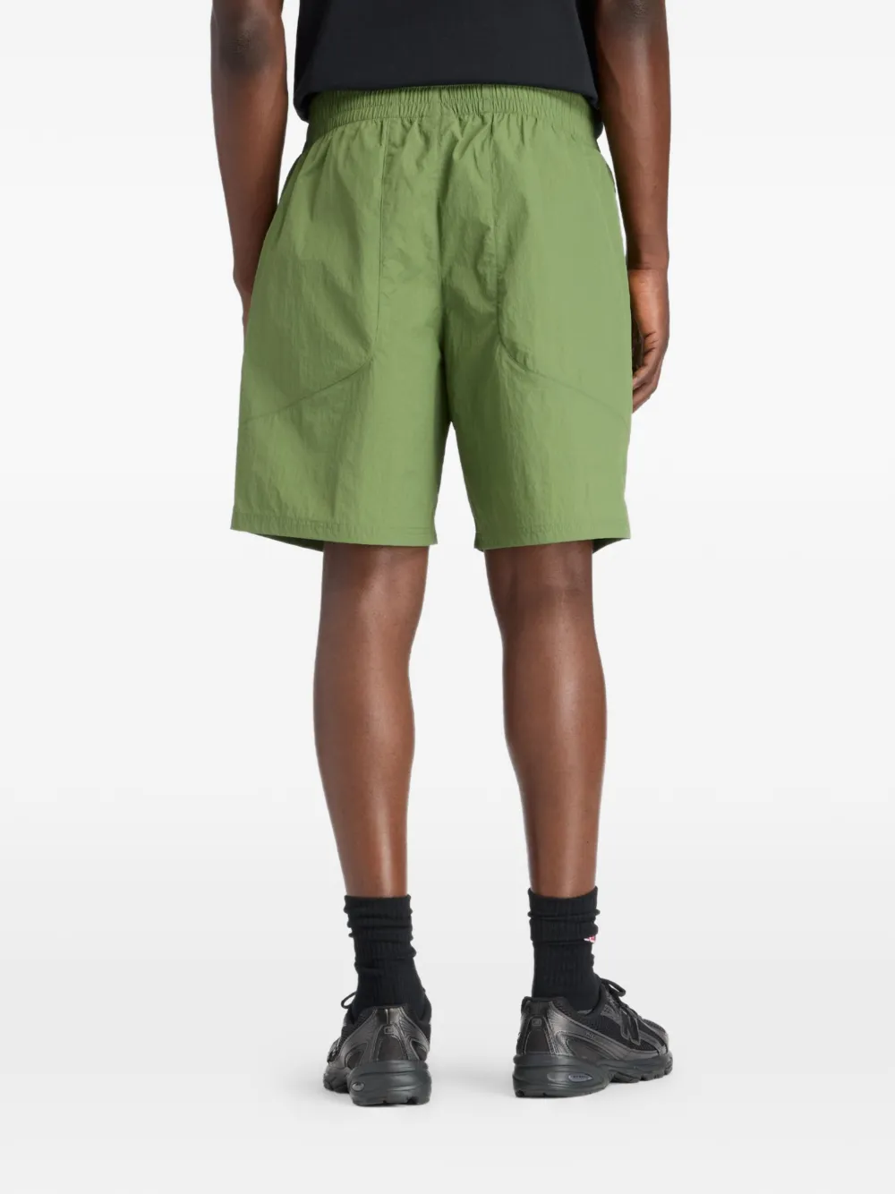 New Balance Castlefield Woven 7" shorts Groen