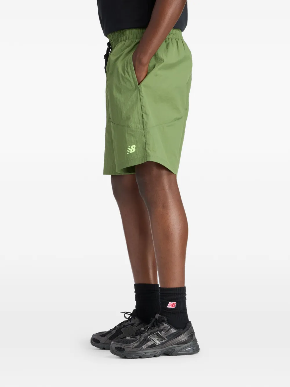 New Balance Castlefield Woven 7" shorts Groen