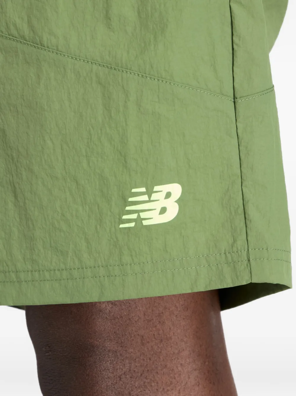 New Balance Castlefield Woven 7" shorts Groen