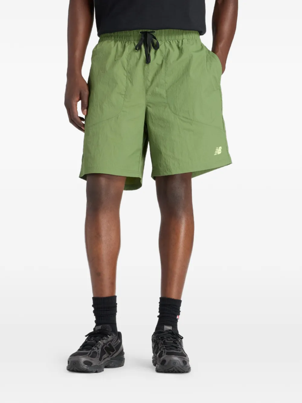 New Balance Castlefield Woven 7" shorts - Verde