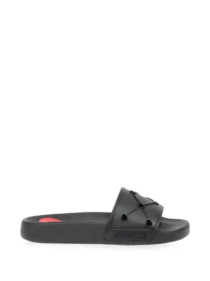 Moschino logo-plaque Slides | Black | FARFETCH