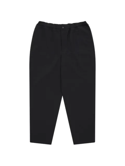 Black Comme Des Garçons elasticated-waistband tapered trousers