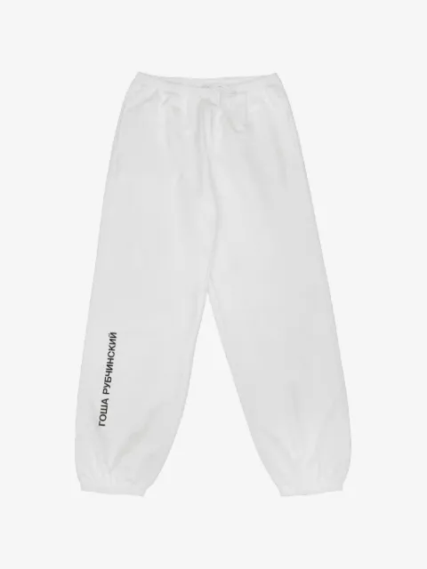 GOSHA RUBCHINSKIY pants con logo estampado