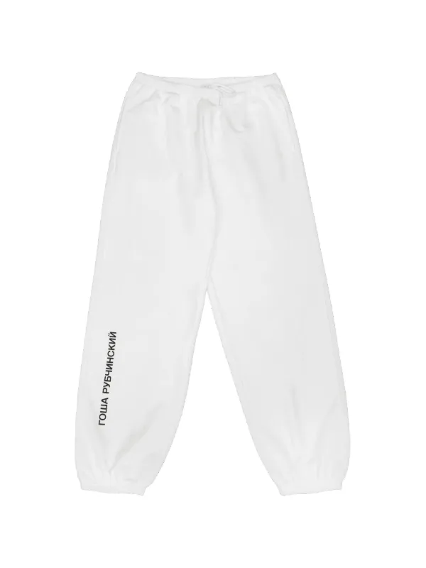 GOSHA RUBCHINSKIY ロゴ トラックパンツ | ホワイト | FARFETCH JP
