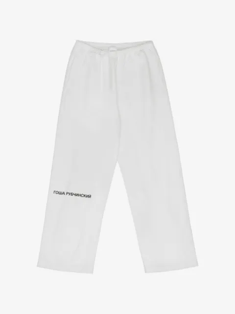 GOSHA RUBCHINSKIY pants con logo estampado