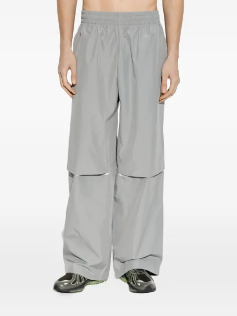 New Balance pants con ribete reflectante