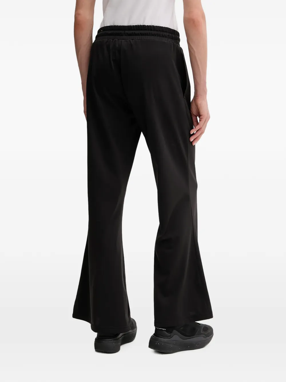 PUMA Trainingsbroek met trekkoord en flared pijpen Zwart