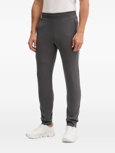 PUMA logo-print panelled track pants
