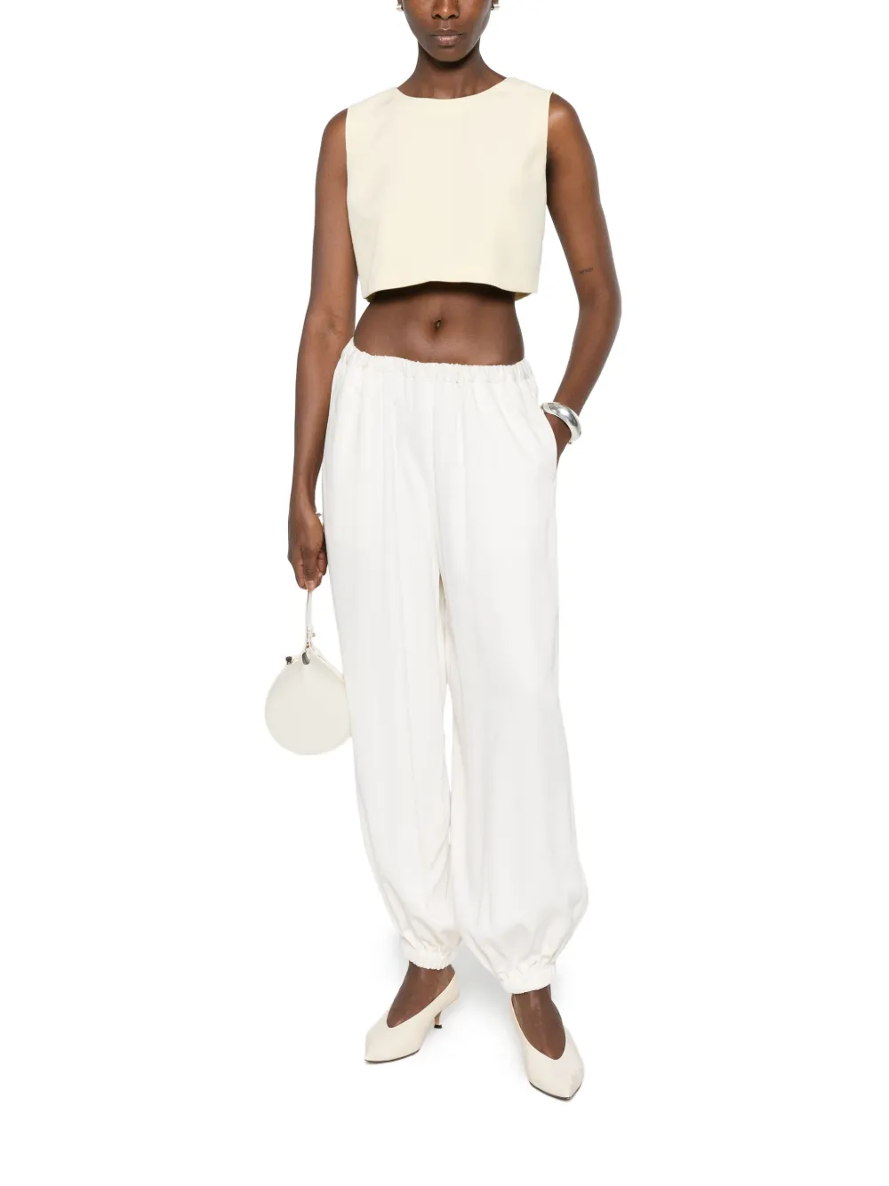 CARLA G. Vaud cropped mouwloze top Geel