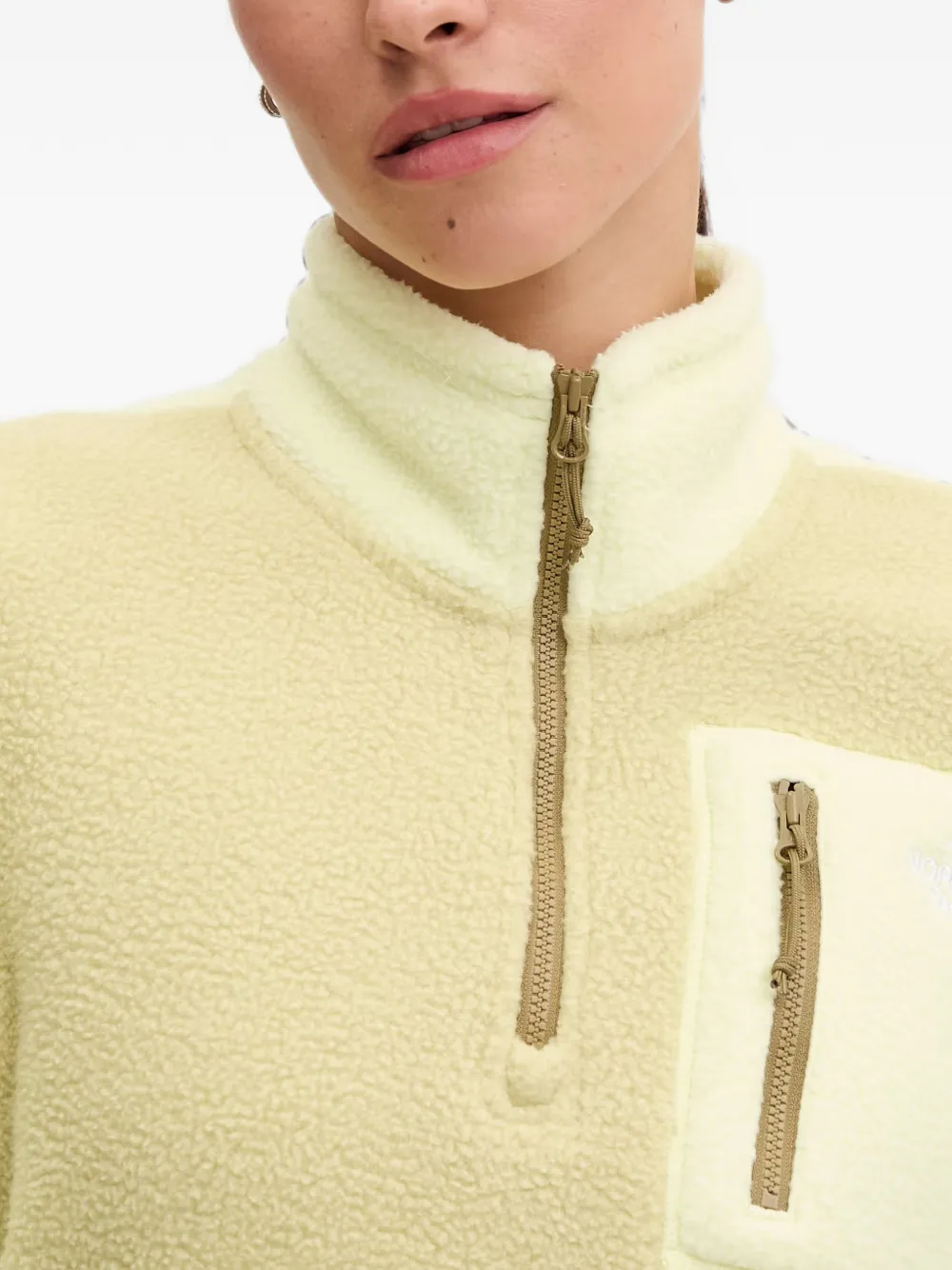 The North Face Sweater met fleece textuur en kwartrits Geel