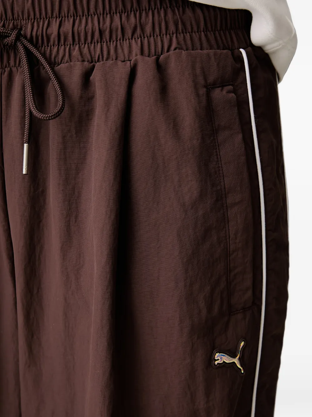 PUMA Trainingsbroek met trekkoordtaille en zijstreep Bruin