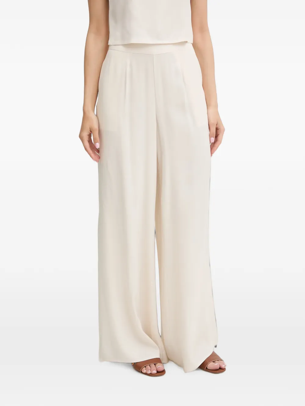 GUESS USA logo-patch wide-leg trousers - Toni neutri