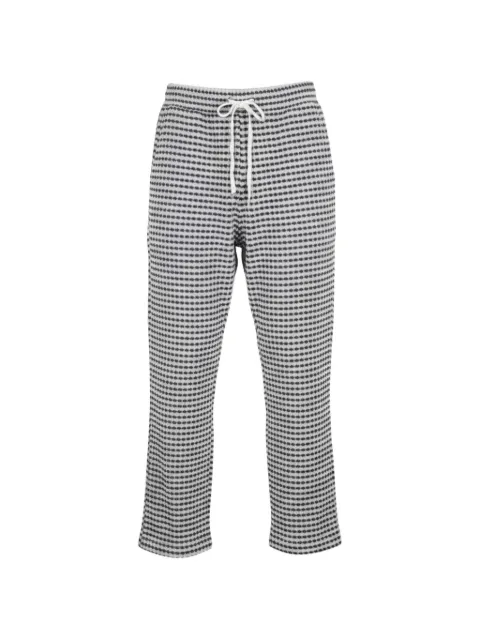 CHÉ patterned drawstring track pants