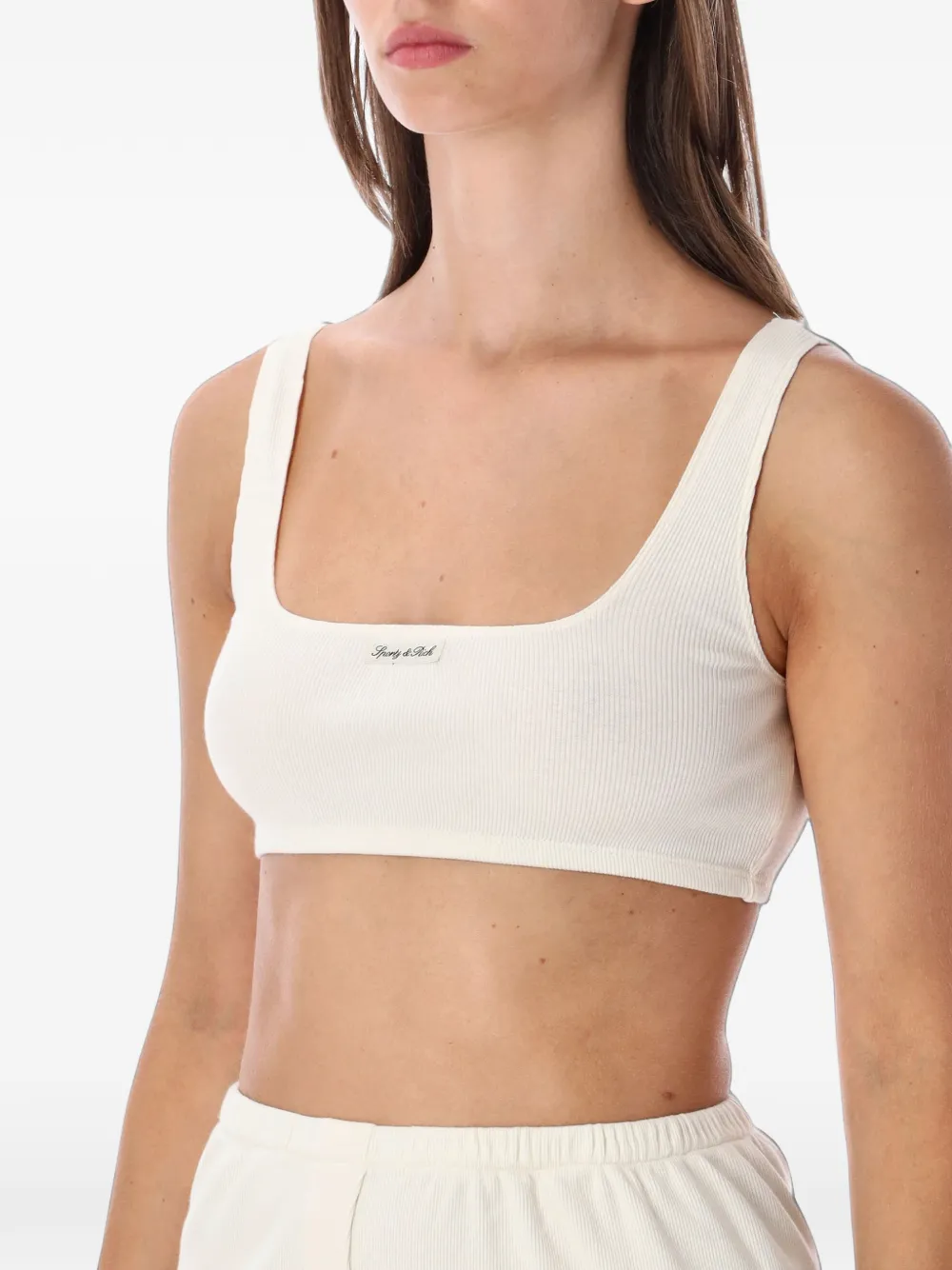 Sporty & Rich Ribgebreide cropped top met logo-patch Beige