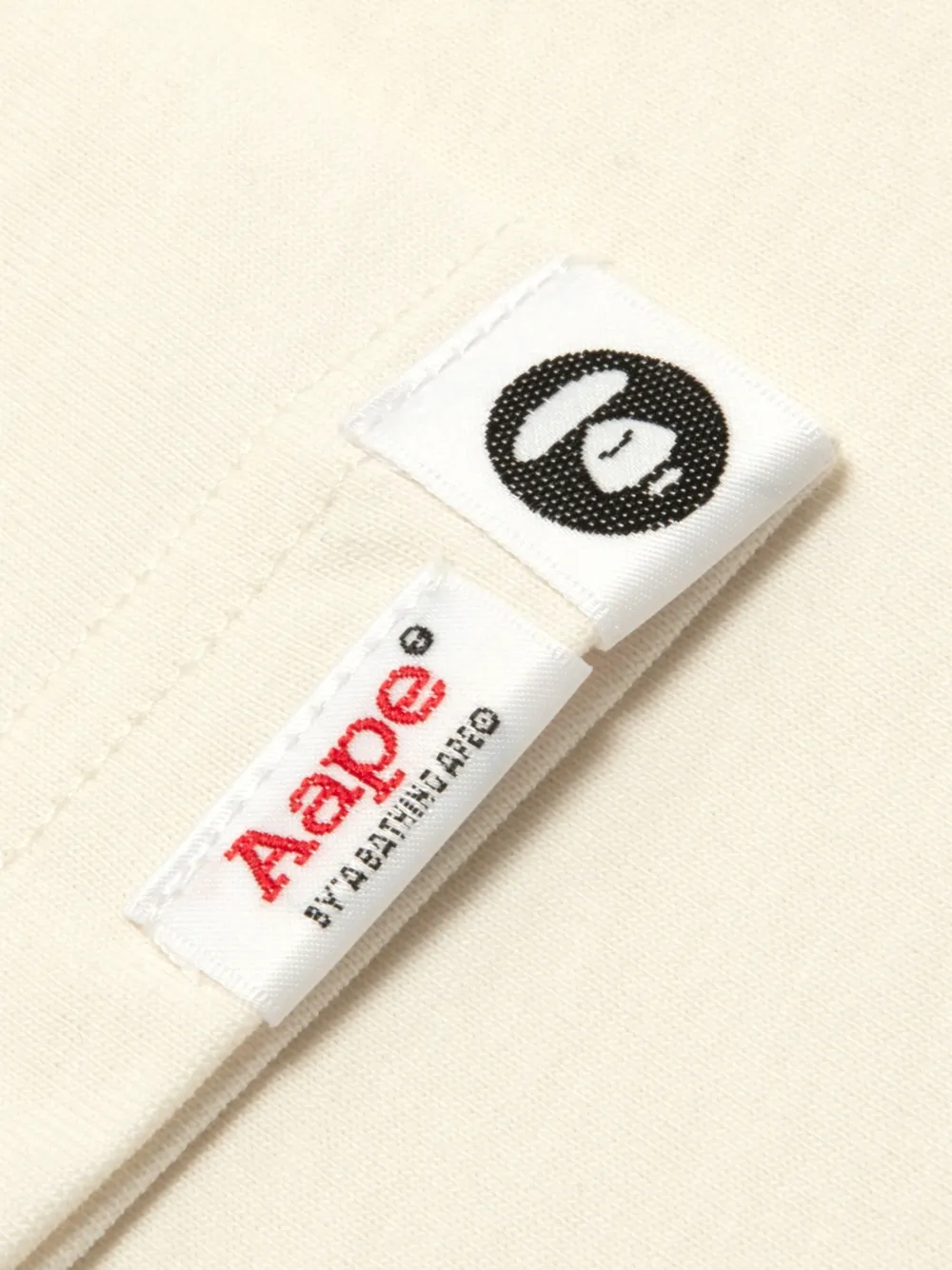 AAPE BY *A BATHING APE T-shirt met logopatch en Moonface-print Beige