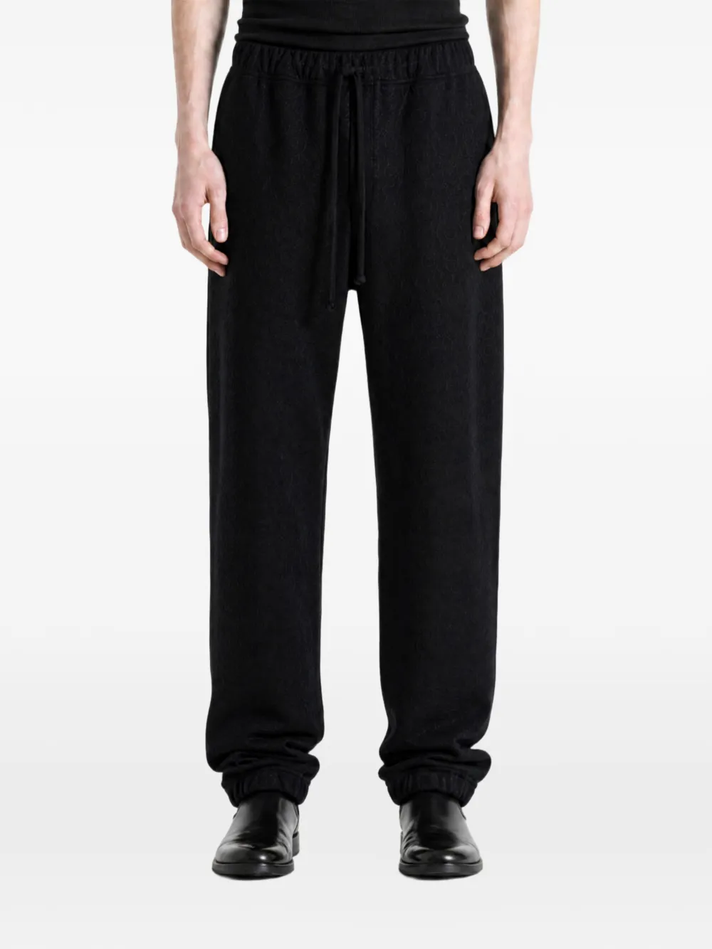 MONONOKE MADE sunflower-print track pants - Nero