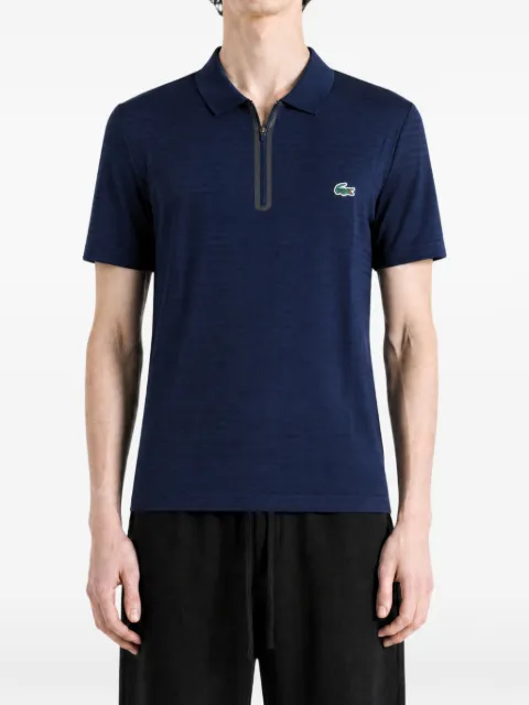 Lacoste polo con parche del logo y cremallera