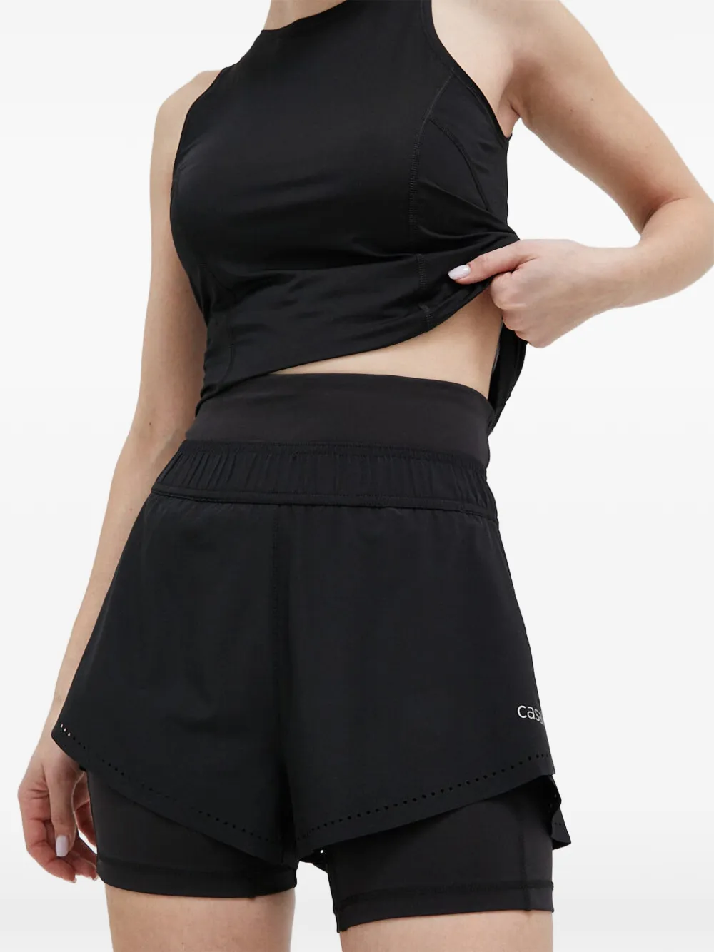 Casall layered laser-cut shorts
