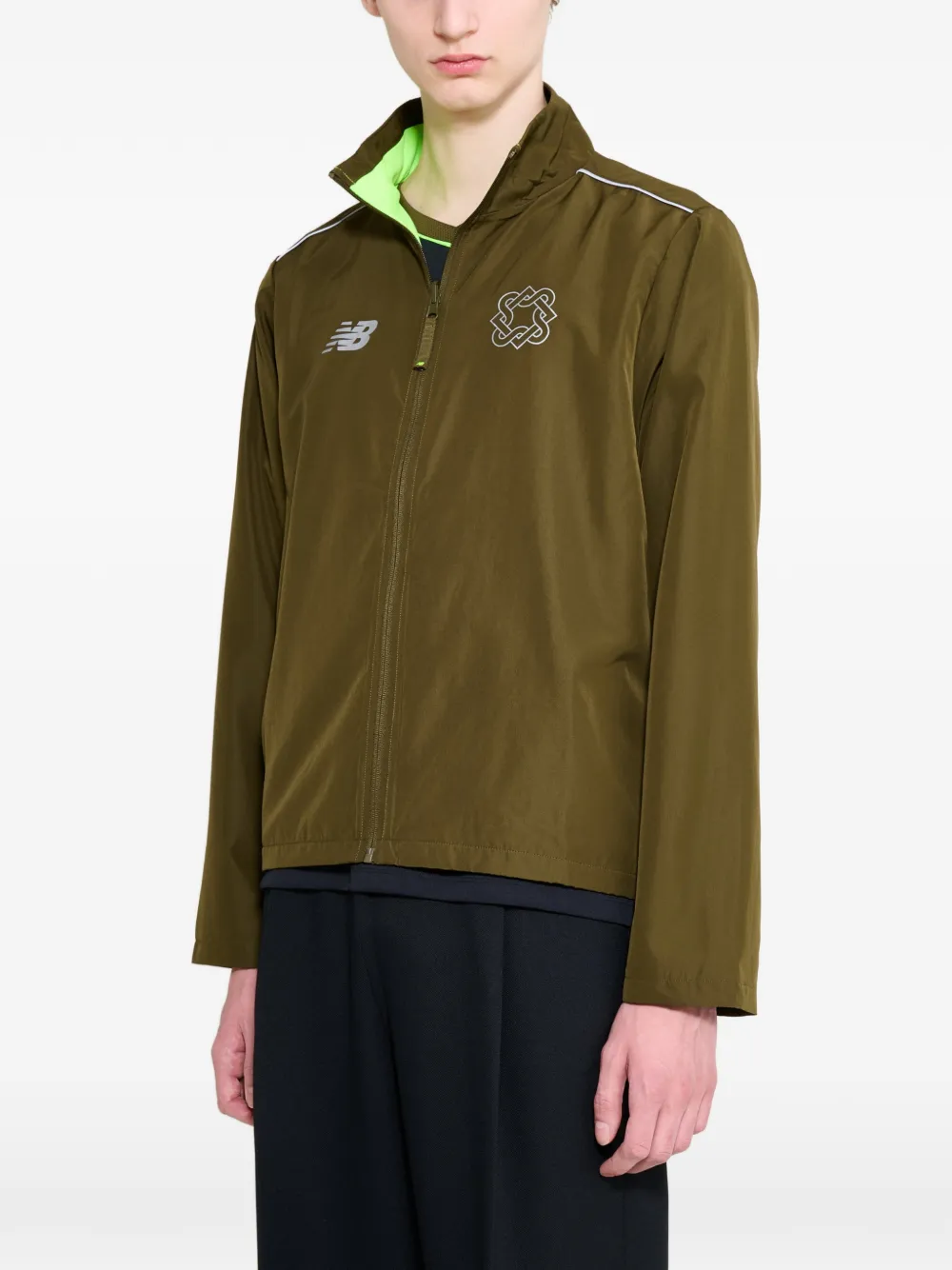 New Balance Lack of Guidance omkeerbaar jack met logoprint Groen