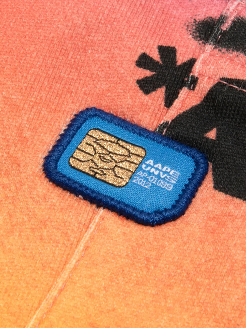 AAPE BY *A BATHING APE Shorts met graffiti-print Oranje