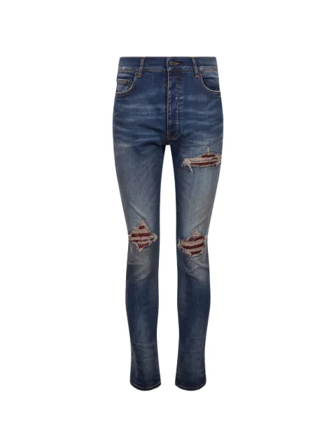AMIRI vaqueros con efecto patchwork y diseño envejecido