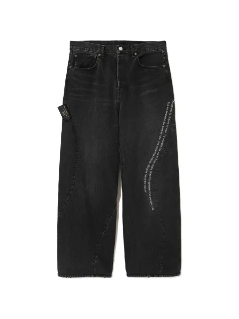 Undercover slogan-print panelled jeans