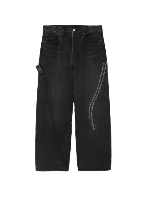 Undercover slogan-print panelled jeans