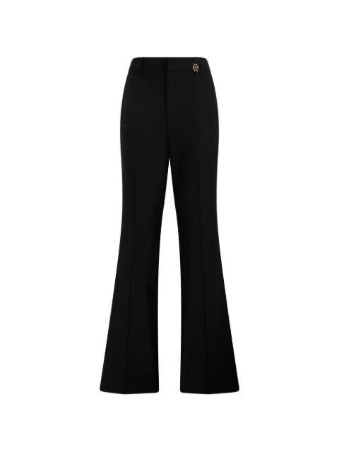 Philipp Plein Pantaloni svasati con placca logo