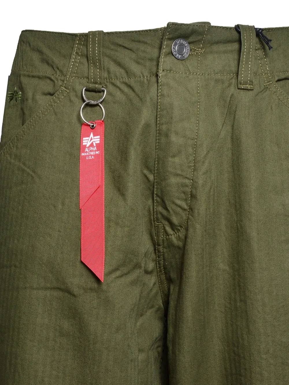 Alpha Industries Broek met visgraatpatroon en toelopende pijpen Groen