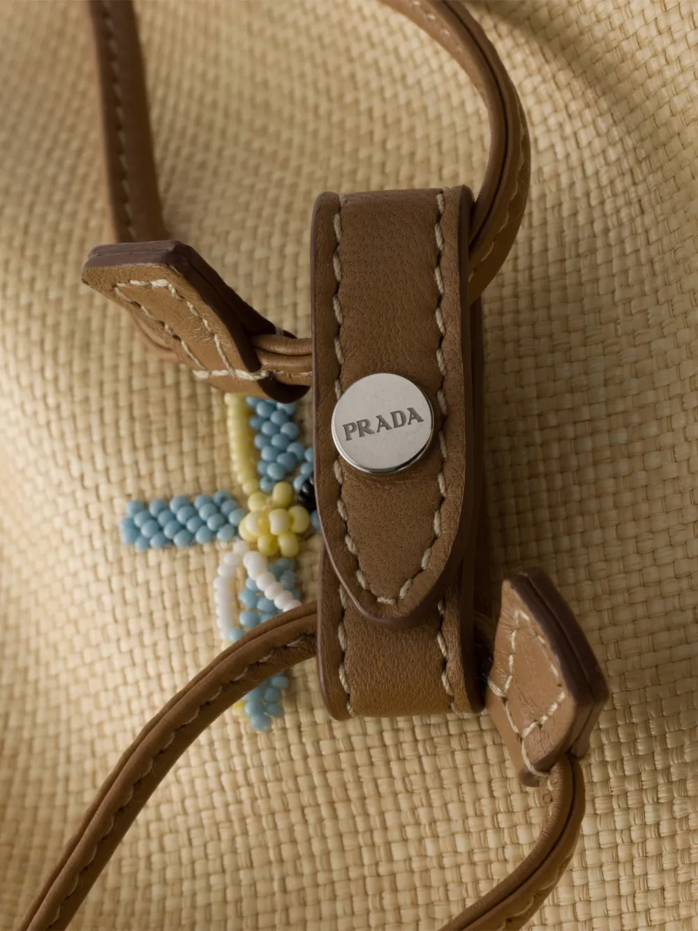 Prada Wish canvas buidel met borduurwerk Beige