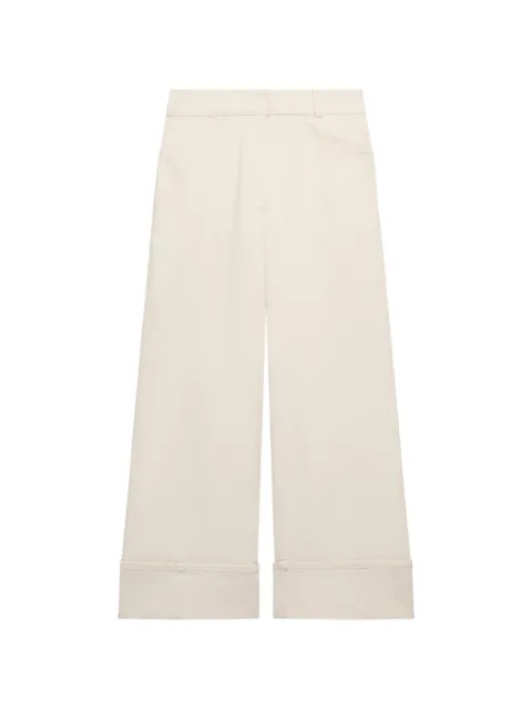 Another Tomorrow jeans con dobladillo vuelto