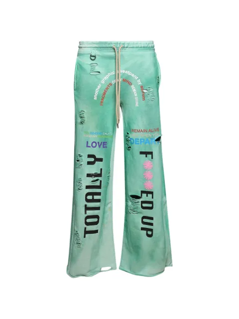 astrum distressed graphic-print track pants