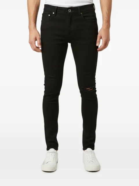 AMIRI distressed skinny jeans